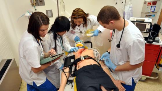 health science students working on simulation dummy